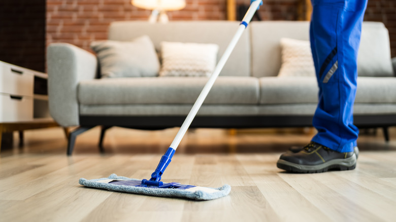 Cleaning wood floors with mop