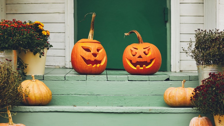 Two pumpkins on a porch