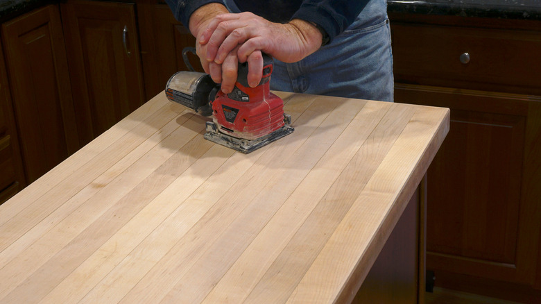 Sanding a butcher block surface