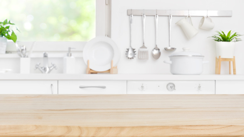 White kitchen with butcher block island