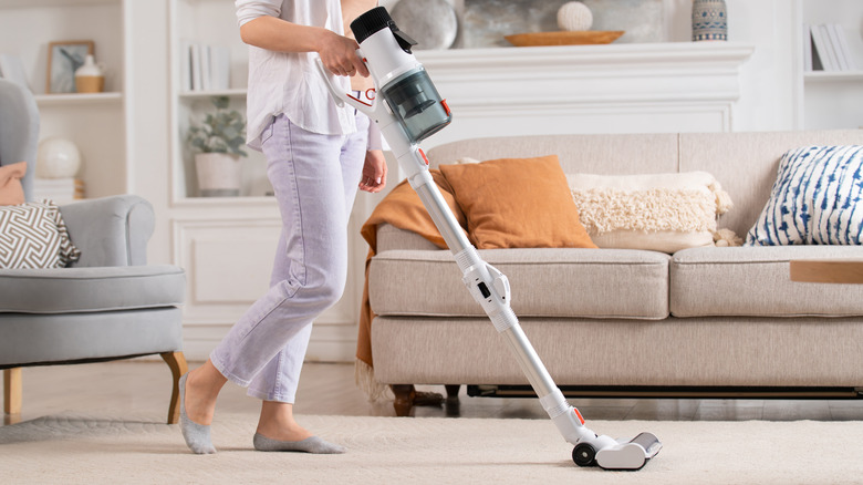 woman vacuuming carpet