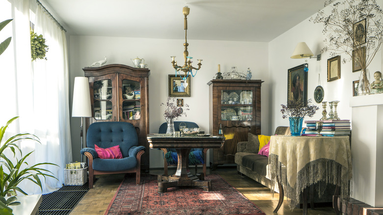 An outdated living room with vintage furniture