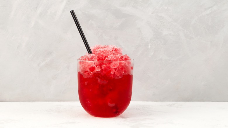 red drink on white countertop