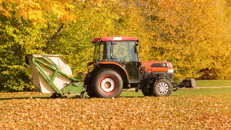 tractor towing lawn sweeper