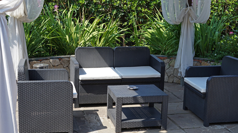 Patio furniture under sun shade