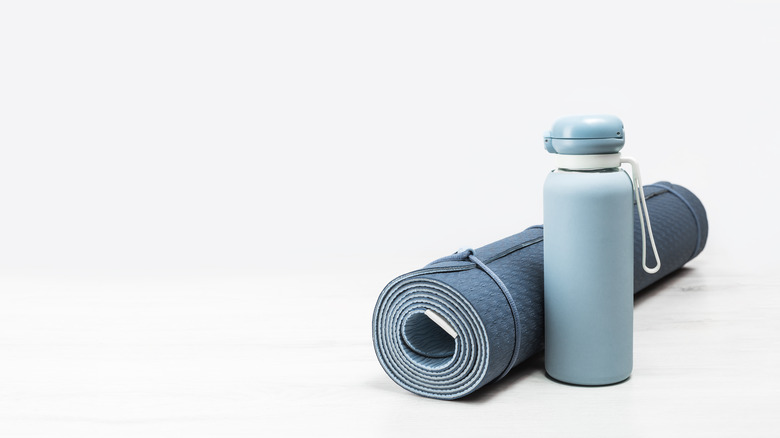 Blue yoga mat and water bottle