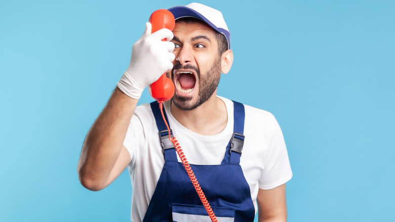 Handyman yelling over a phone