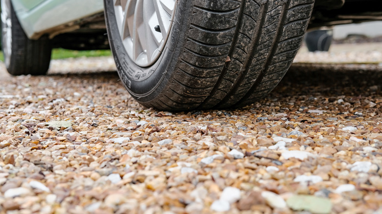 car on gravel driveway