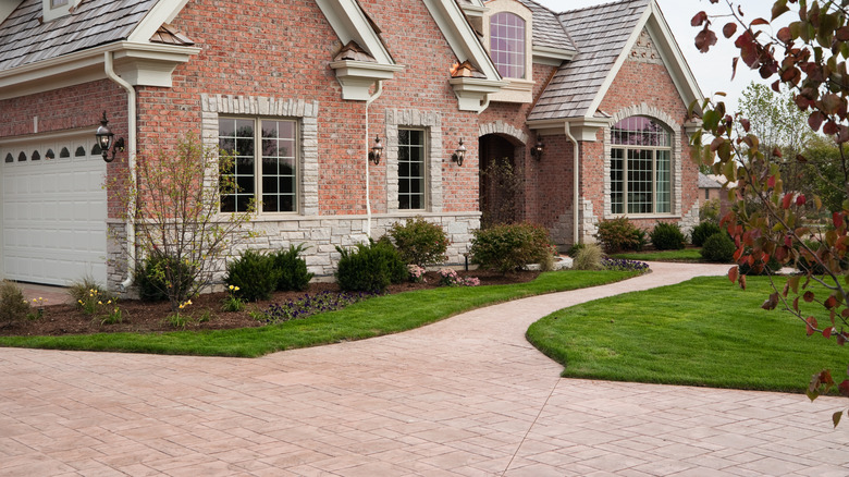 house with brick driveway