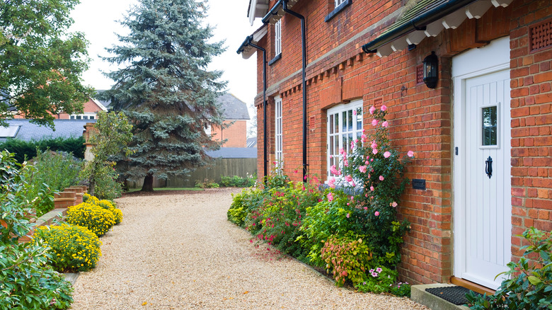 Brick house with gravel driveway