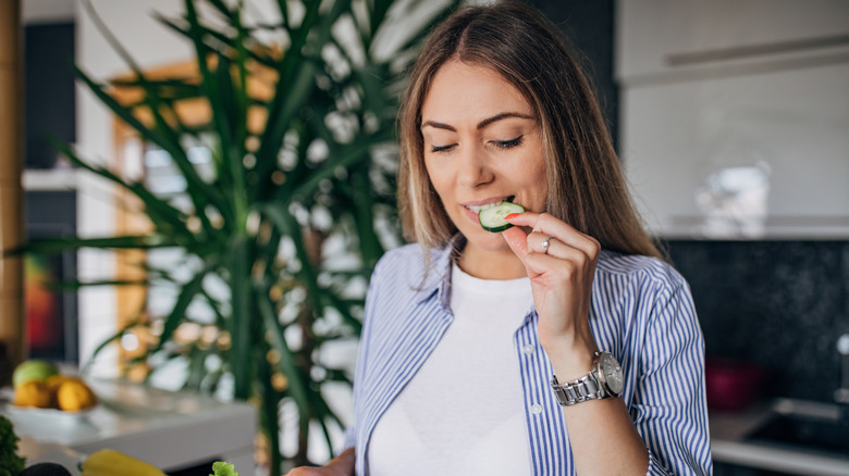 woman eating cucumbers