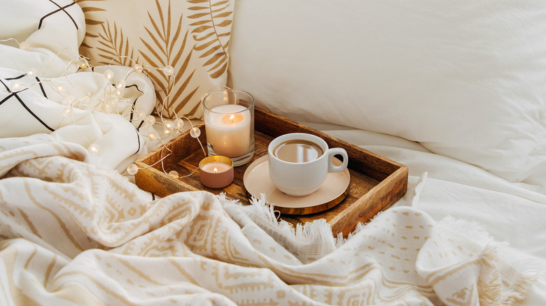 coffee on bed tray in bed