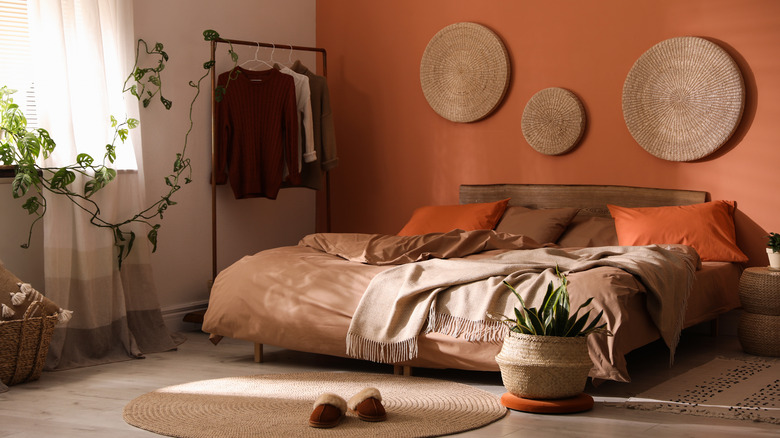 orange bedroom with rug