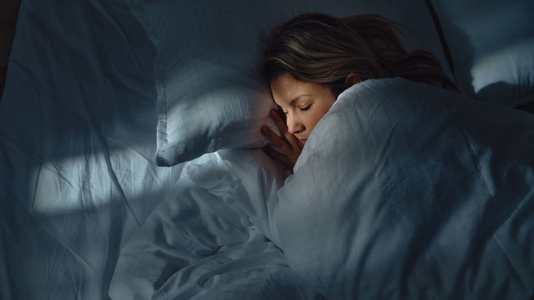 Woman sleeping in bed