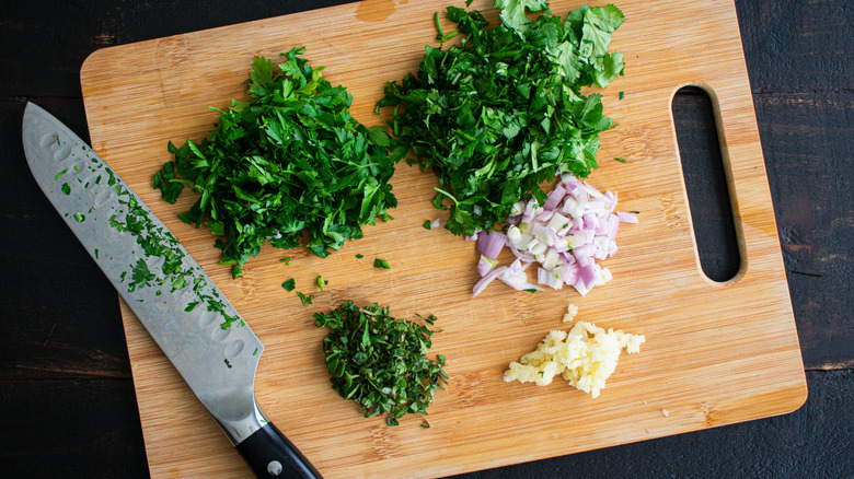 Chopped herbs on cutting board