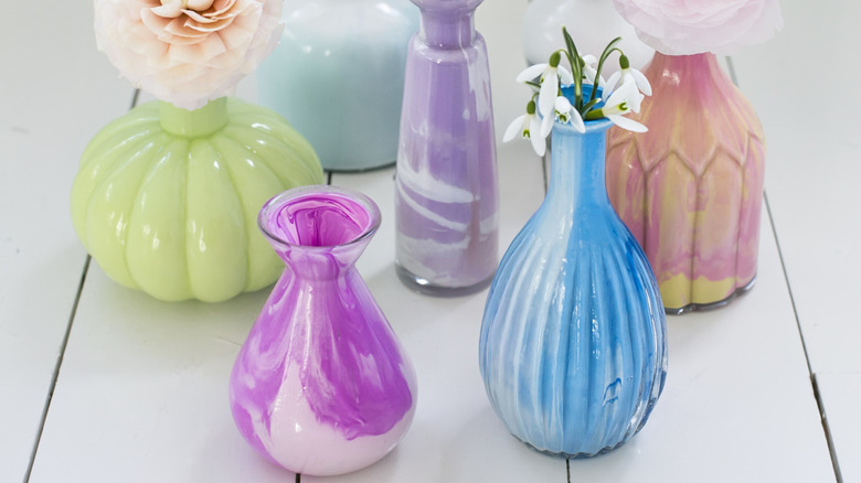 Variety of DIY painted glass vases in various colors