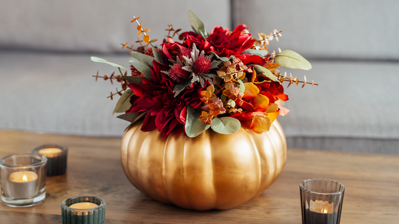 flowers inside golden pumpkin 