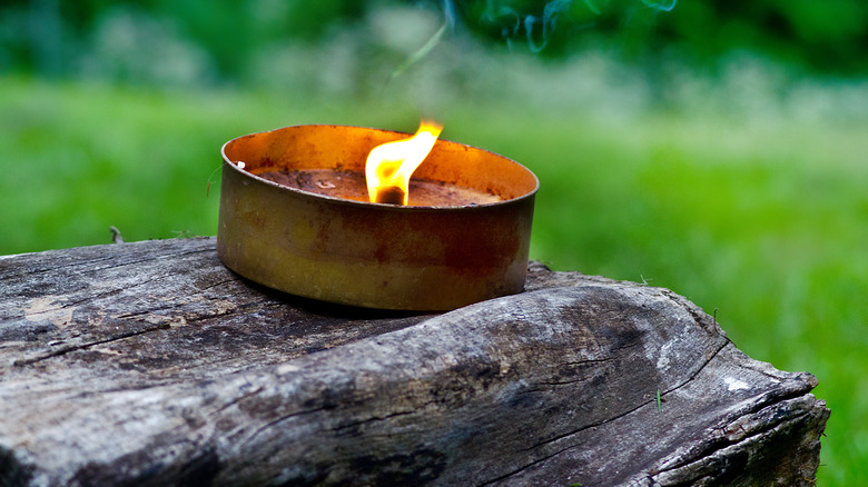 citronella candle burning outdoors