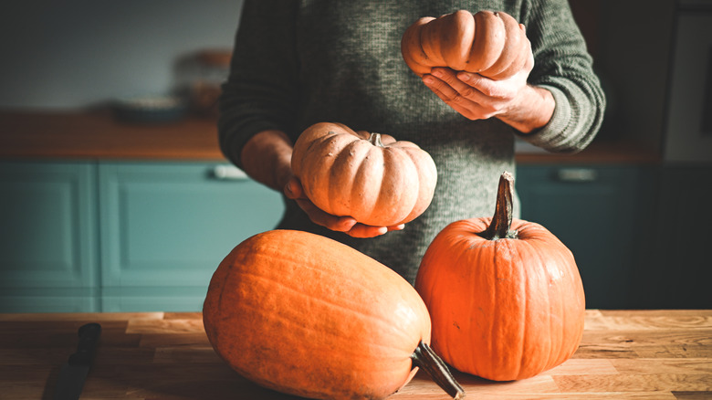 woman with pumpkins