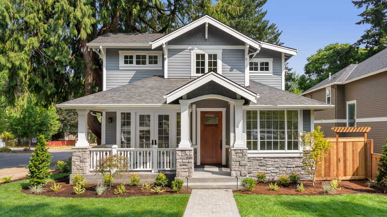 gray suburban house with porch