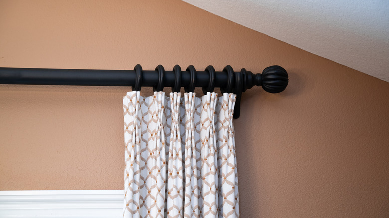 Curtain rod above a window