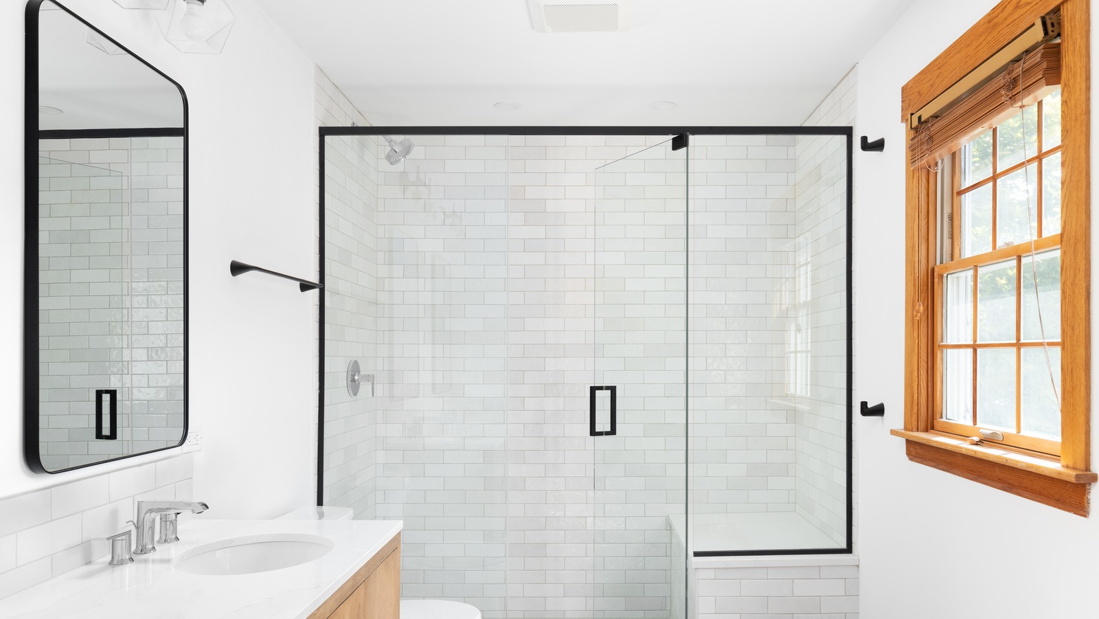 How To Make The Curtain-Less Shower Trend Work In Your Bathroom