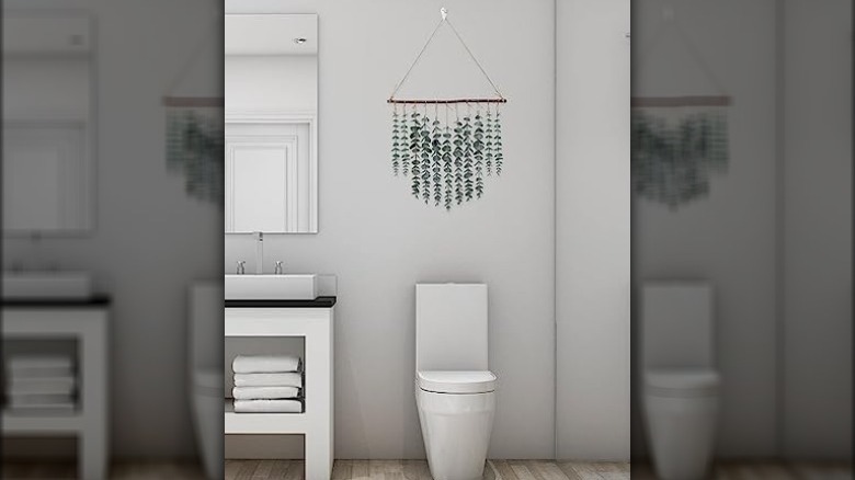 fake plants above a toilet