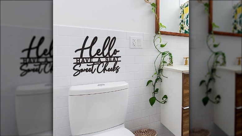 text art above a toilet