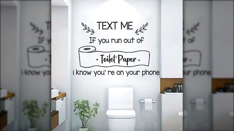 wall sticker above a toilet