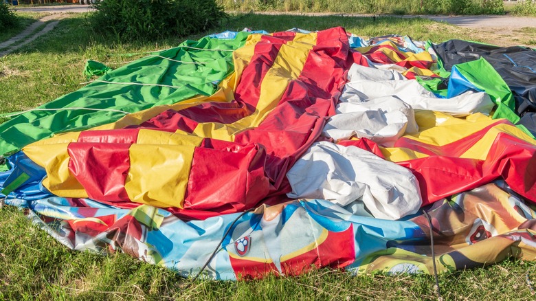 deflated bounce house on lawn