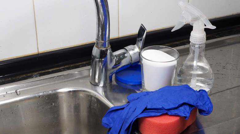 cleaning supplies next to sink