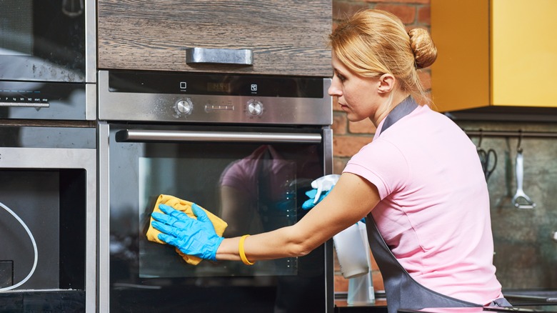 Wiping down oven door 