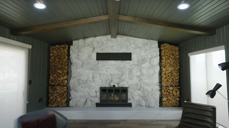 Whitewashed stone fireplace