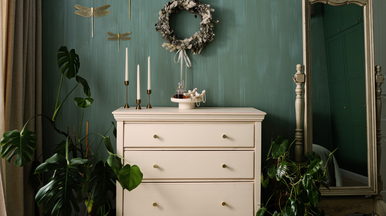 Dresser with three drawers standing in a room