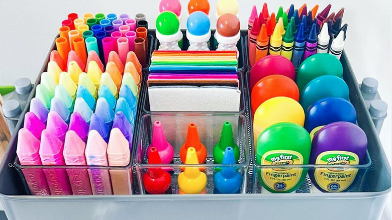 rainbow organized crayons and paint