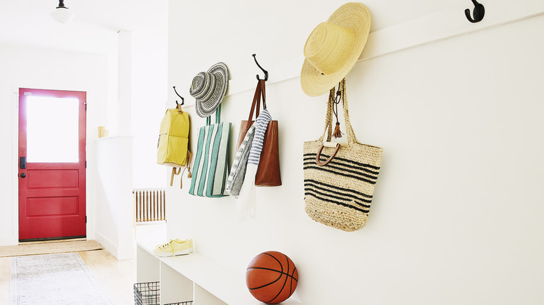 summer items hanging in mudroom