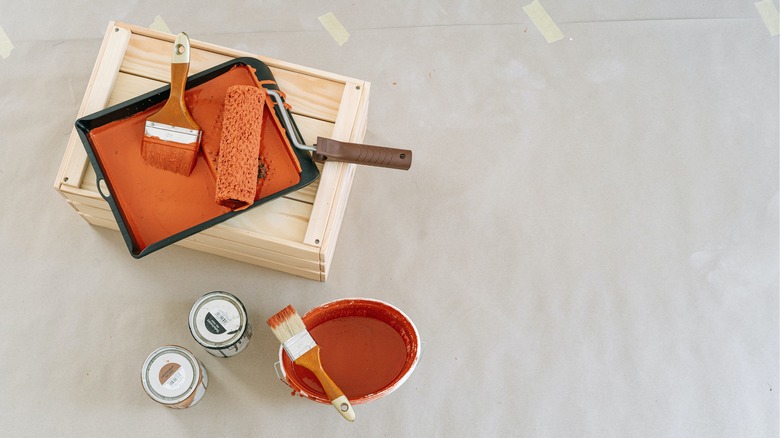 orange paint with paint brush