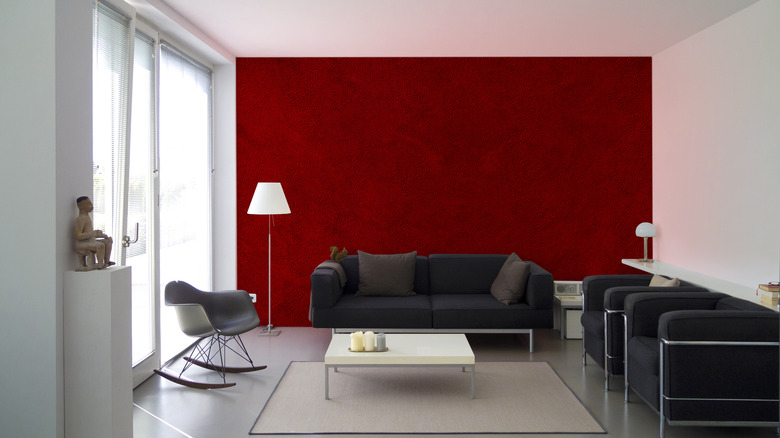 living room with dark red wall 