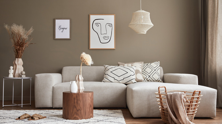 beige wall minimalistic art and couch