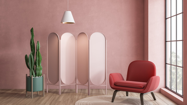 light pink walls cactus and chair 