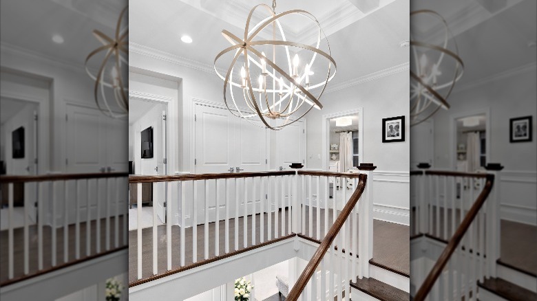 Modern light fixture above staircase