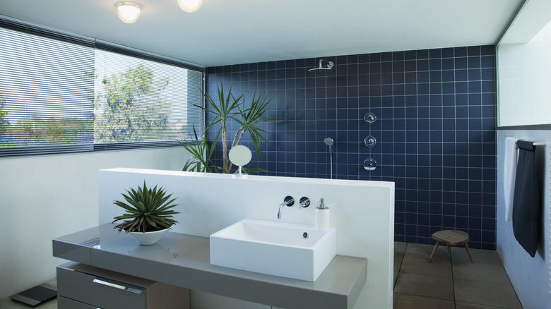 dark blue tile bathroom wall