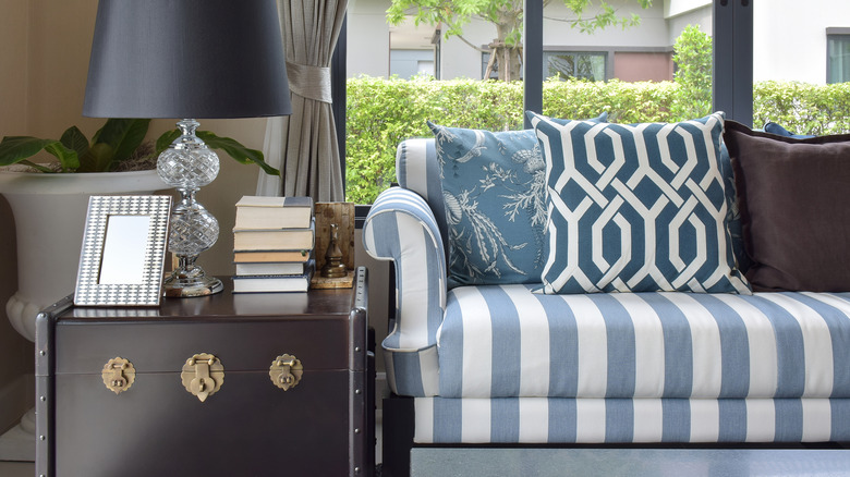 striped sofa with patterned pillows