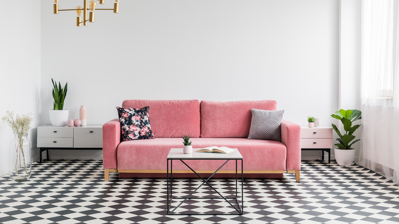 pink couch in checkered living room