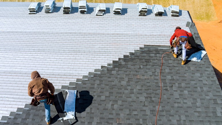 contractors installing new roof