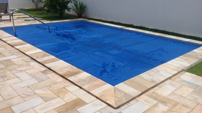 Pool in backyard with cover