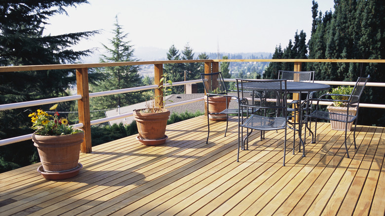 wooden patio deck with outdoor furniture