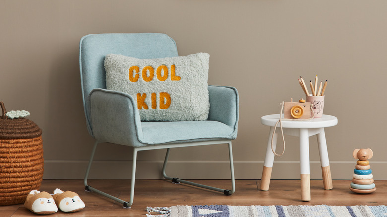 Chair with baby toys and pillow