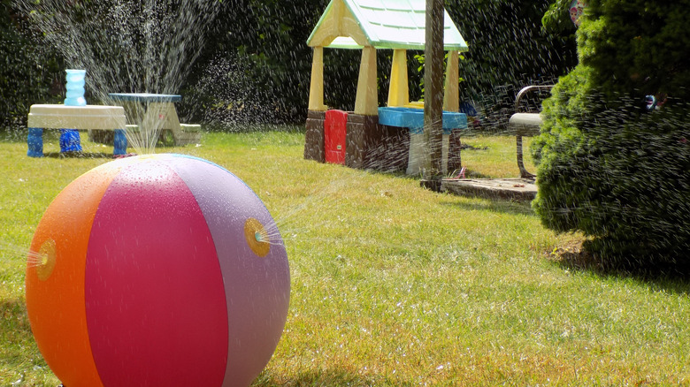 backyard sprinkler with kids' toys