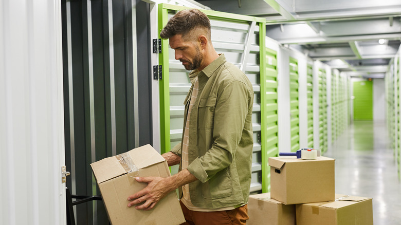 man organizing storage unit